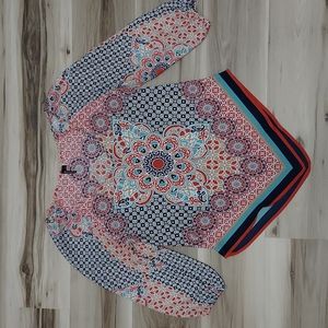 HeartSoul floral bandana hem blouse.asymmetric .Deep V neck.SZ M.